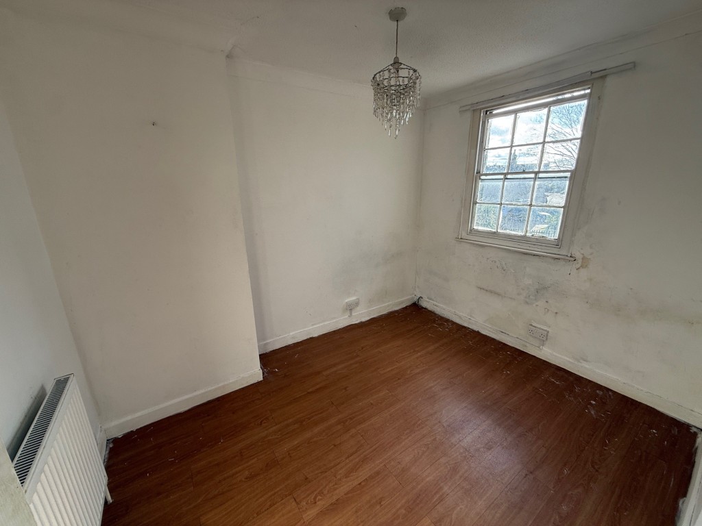 Lot: 11 - END-TERRACE HOUSE FOR IMPROVEMENT - Bedroom two with window to rear